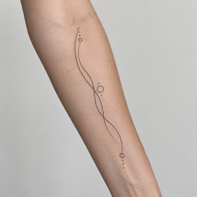 Example healed fine-line forearm tattoo